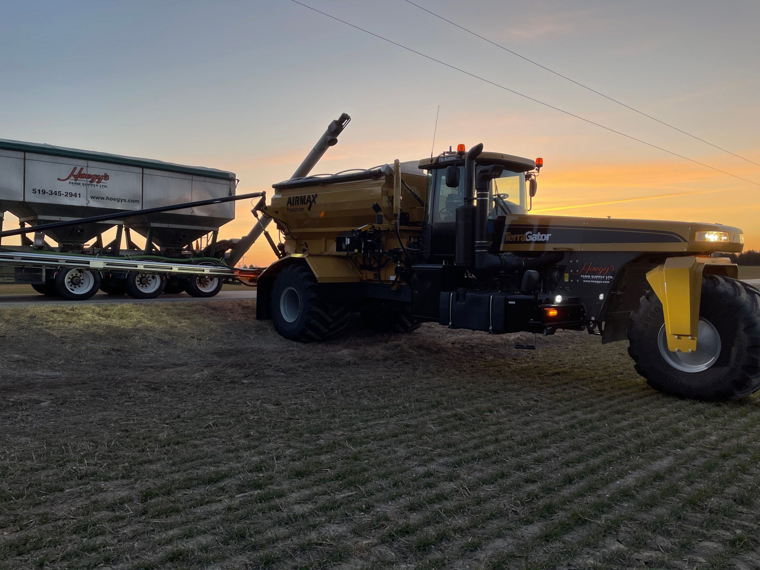 Image of Fertilizer Terra Gator with sunset in the background.